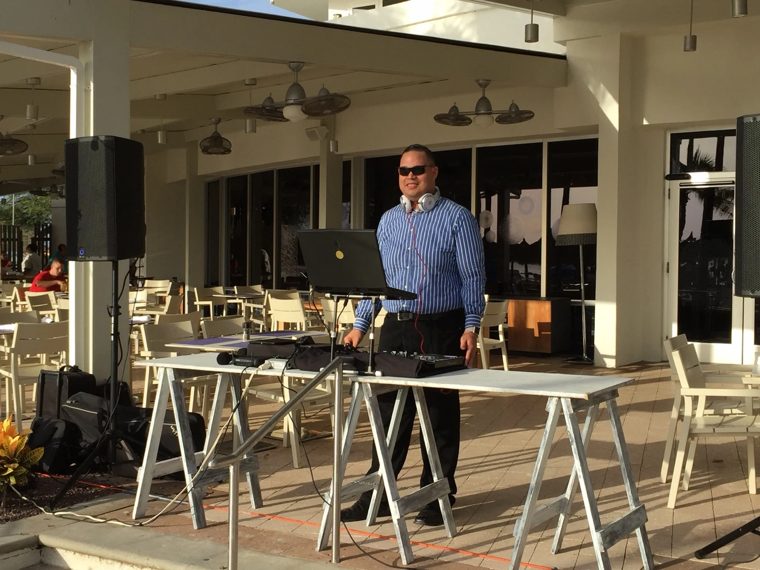 Archive photograph of an earlier outdoor DJ setup with Ruuben in a striped shirt