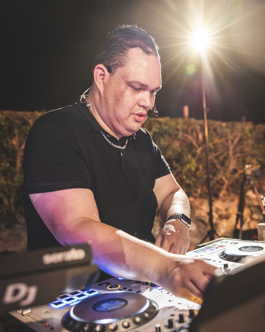 Ruuben focused on mixing at his DJ controller